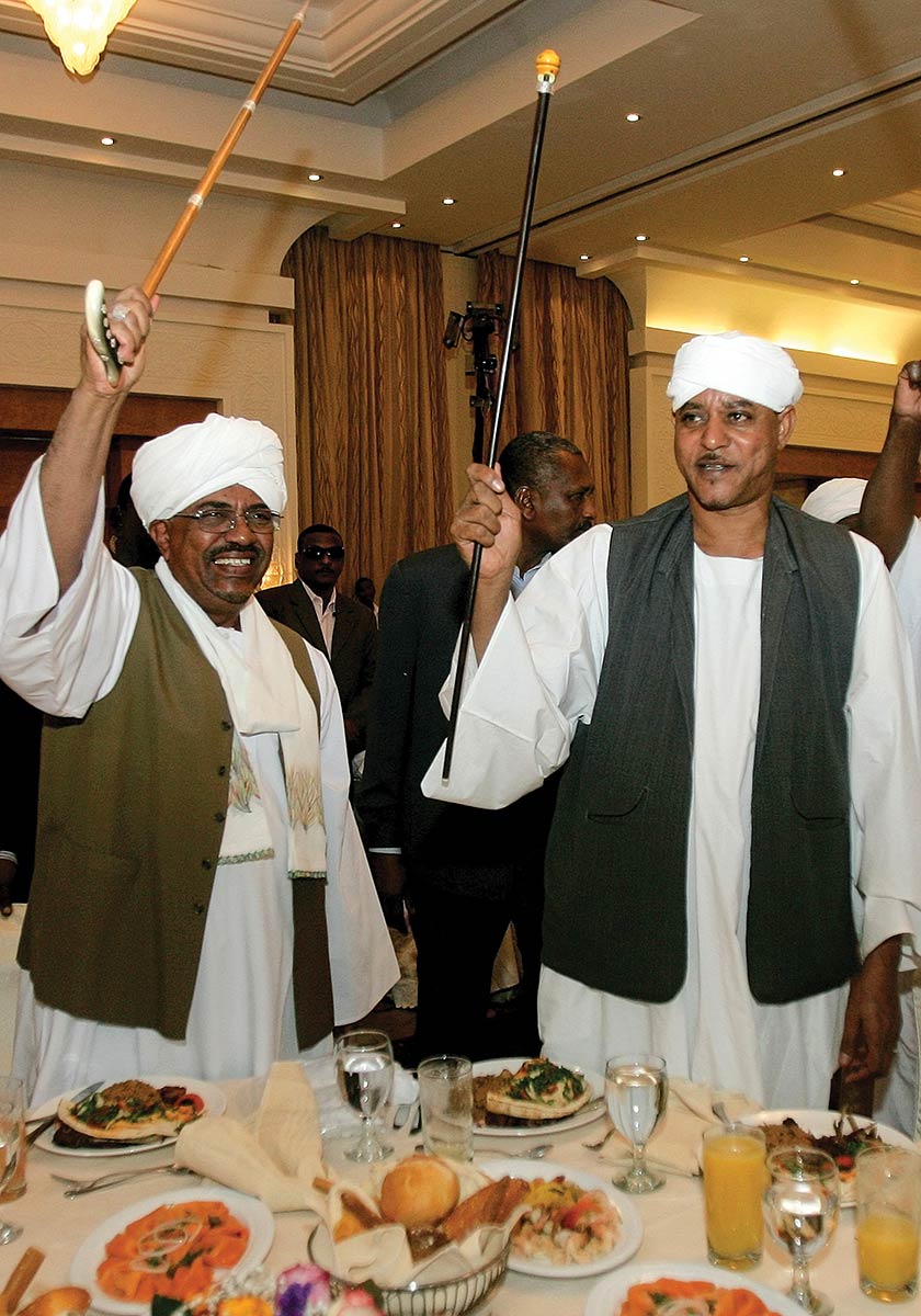 Sudanese President, Omar al-Bashir (left), with Sudan’s Janjaweed militia leader, Mussa Hilal