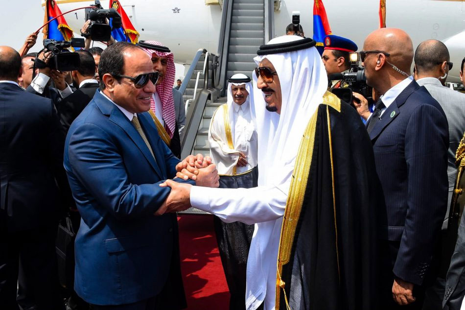 President Sisi shakes hands with King Salman of Saudi Arabia