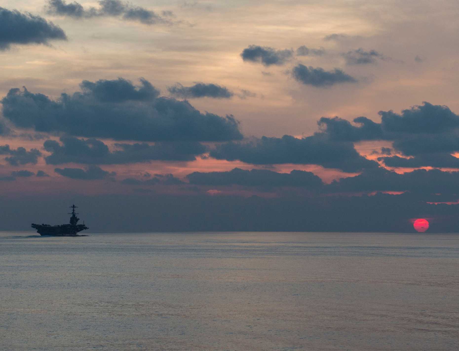 USS John C. Stennis steams at dusk in South China Sea