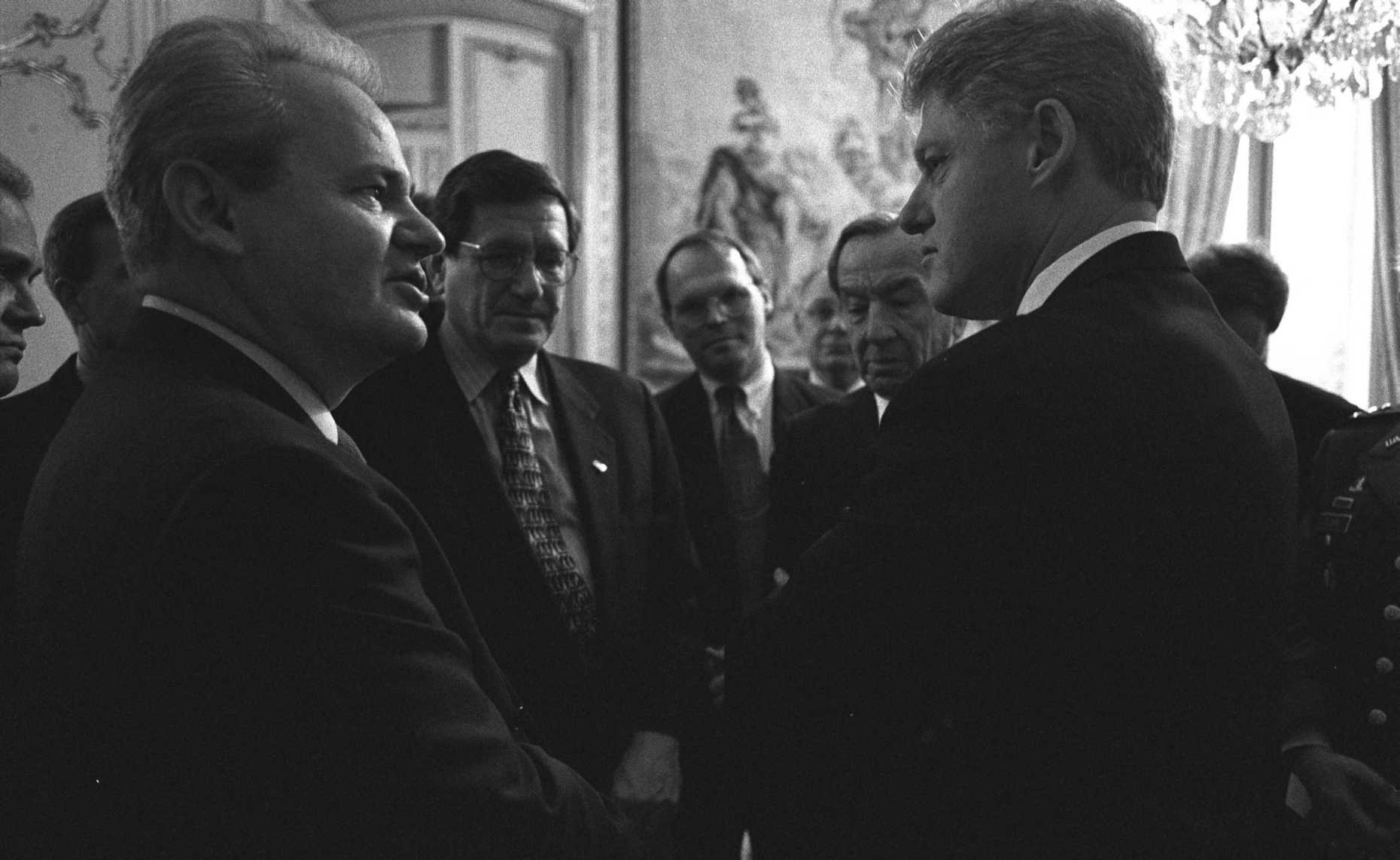 President William J. Clinton talking with Serbian President Slobodan Milosevic