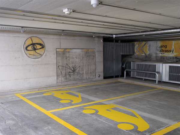 The underground parking garage was also renovated and adapted to new safety regulations. The famous spray paintings by Harald Nägeli can also be seen.