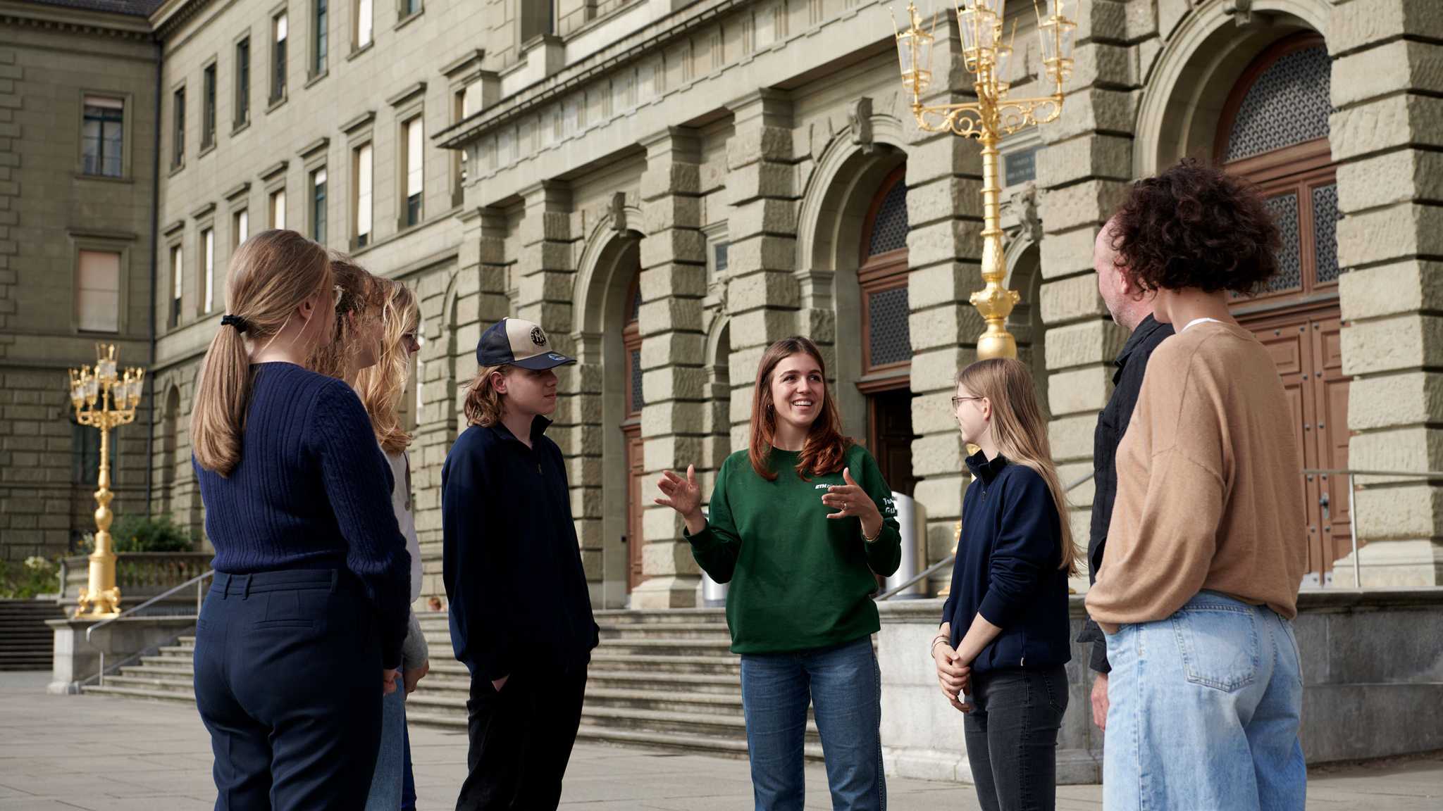 ETH group tour with guide in front of the Campus Centre building