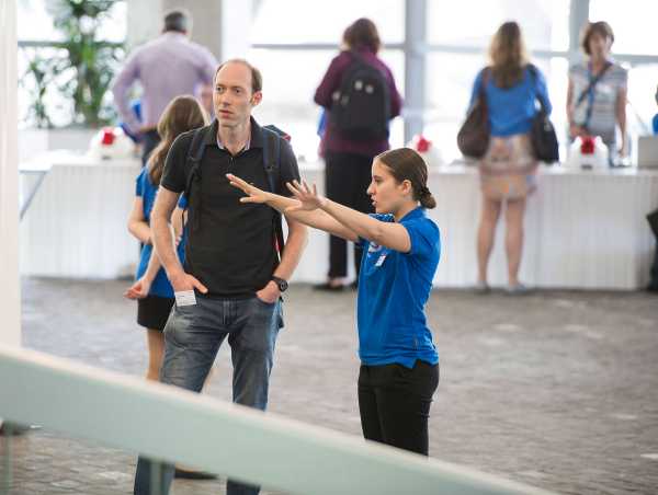 Event helpers guide visitors. (Photograph: Oliver Bartenschlager)