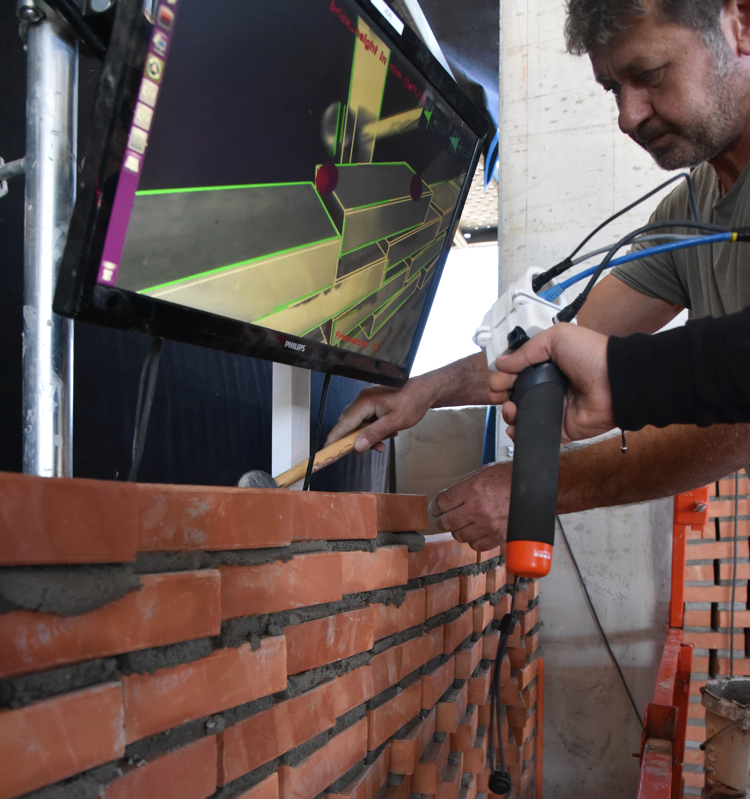 Hand-held guidance system used to construct 230 square meters of brick facade for the Kitrvs Winery in Katerini, Greece