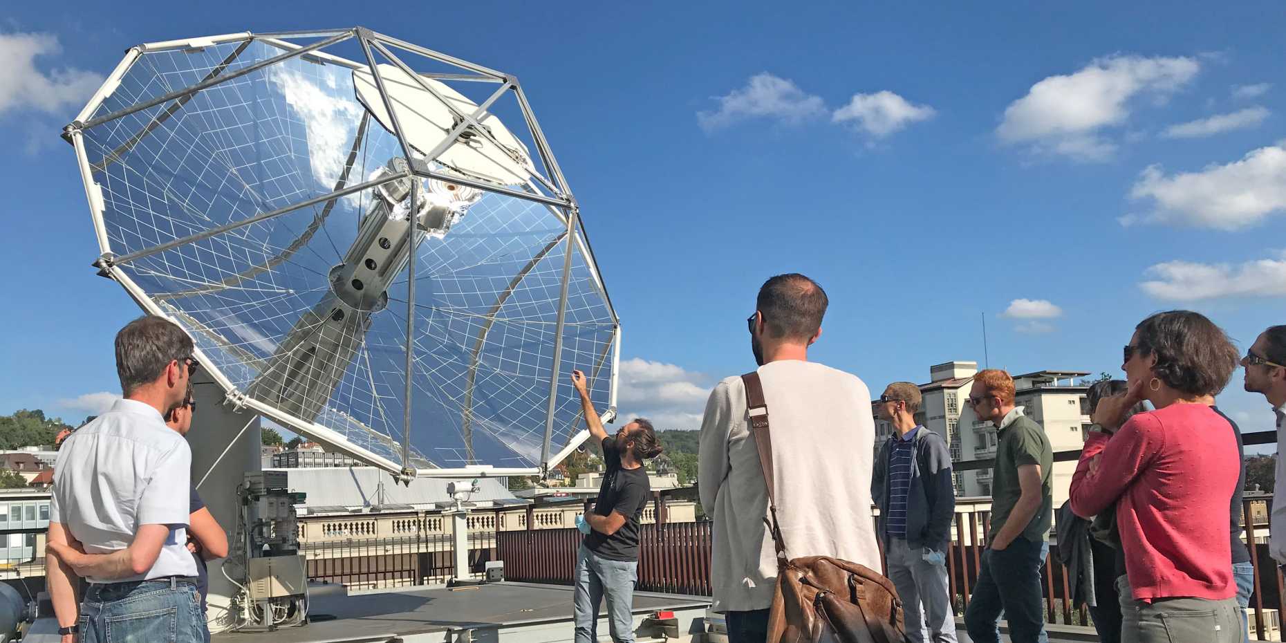 Continuing education students visit the solar reactor on the roof of an ETH building.