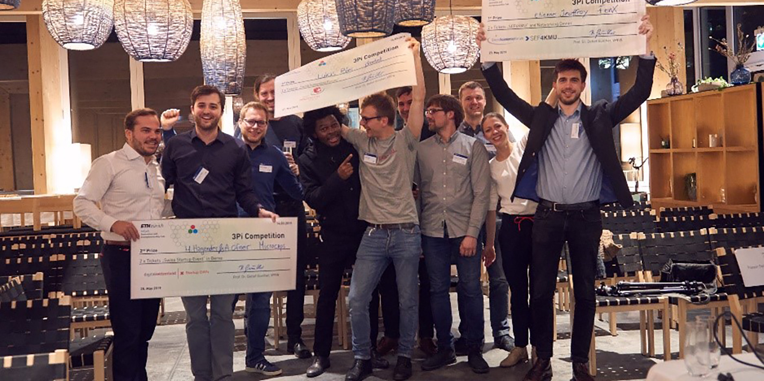 The three winning ETH Pioneer Fellow teams with their winning cheques&nbsp;