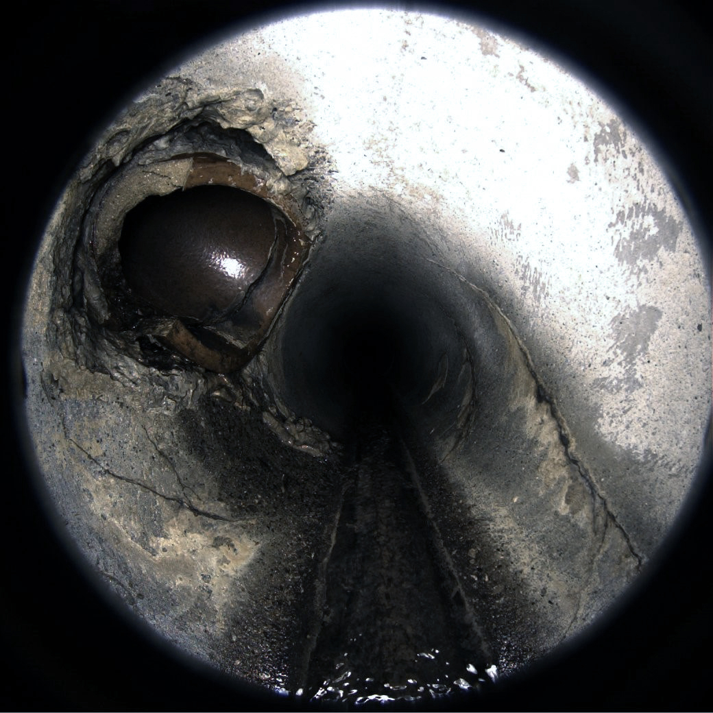 picture of the inside of a damaged drainpipe