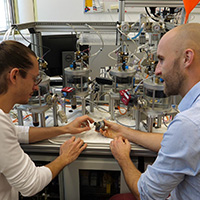 two researchers discussing in a lab