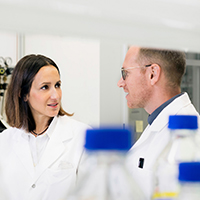 Two people discussing in laboratory