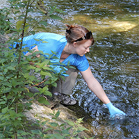 woman taking a water sample
