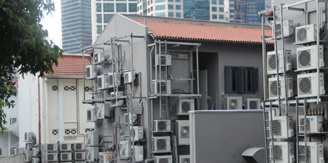 Air conditioners on building walls in Singapore