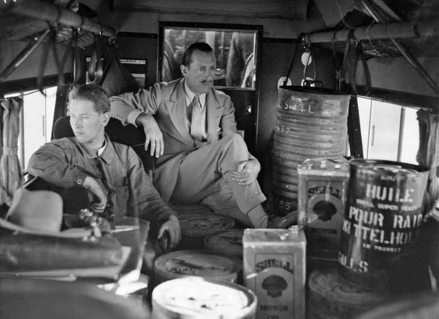 Enlarged view: Mechanic Werner Wegmann and travel organiser Georg Wood in the cabin of an aeroplane
