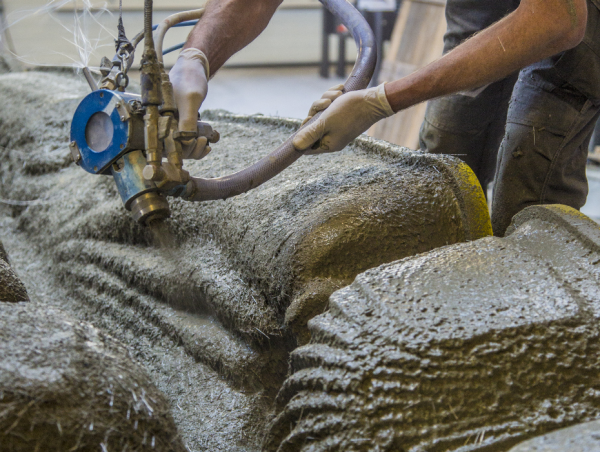 Glass-fibre reinforced concrete being sprayed on the 3D printed formwork in several consecutive layers. (Photograph: ETH Zurich / Andrei Jipa)