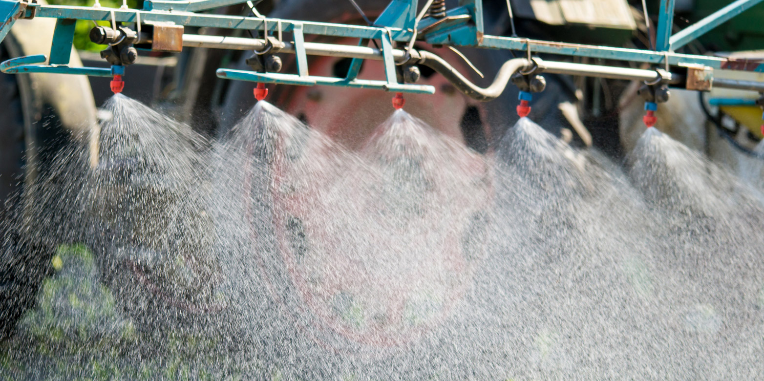 Tractor sprays crop protection agents