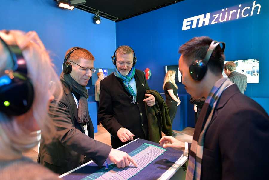 ETH Zurich President Joël Mesot is testing the textile piano keyboard.