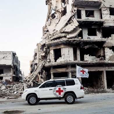 ICRC car with demolished building