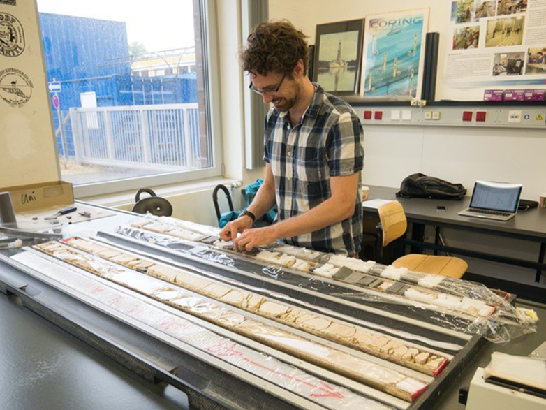 Enlarged view: Matthew Clarkson at work on sediment cores.
