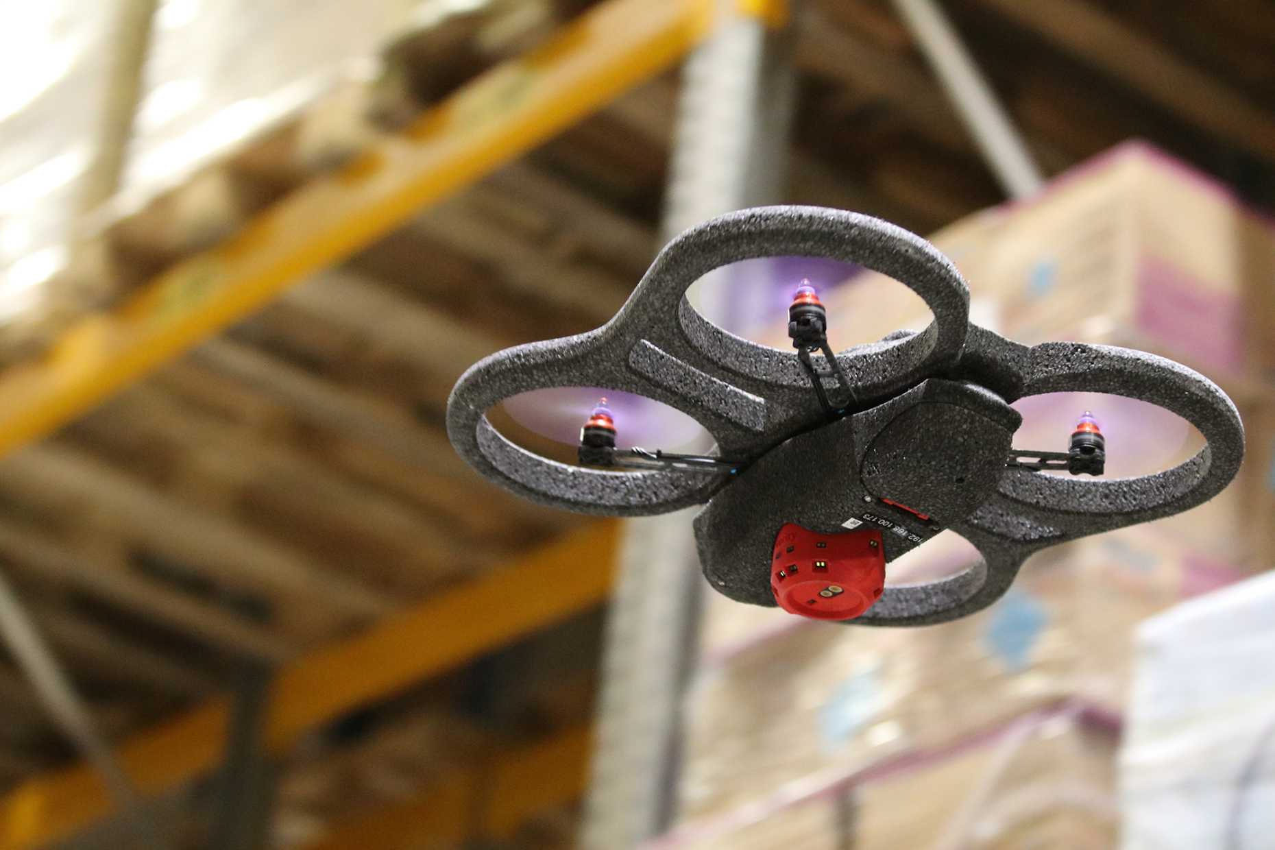 A Verity drone flying in a warehouse