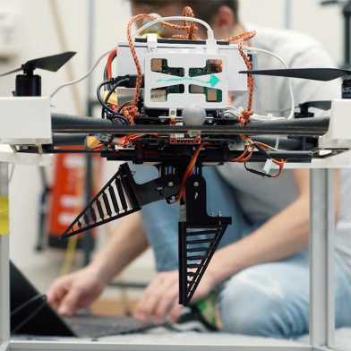 Students work on a drone