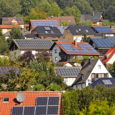 Houses with solar panels on the roofs