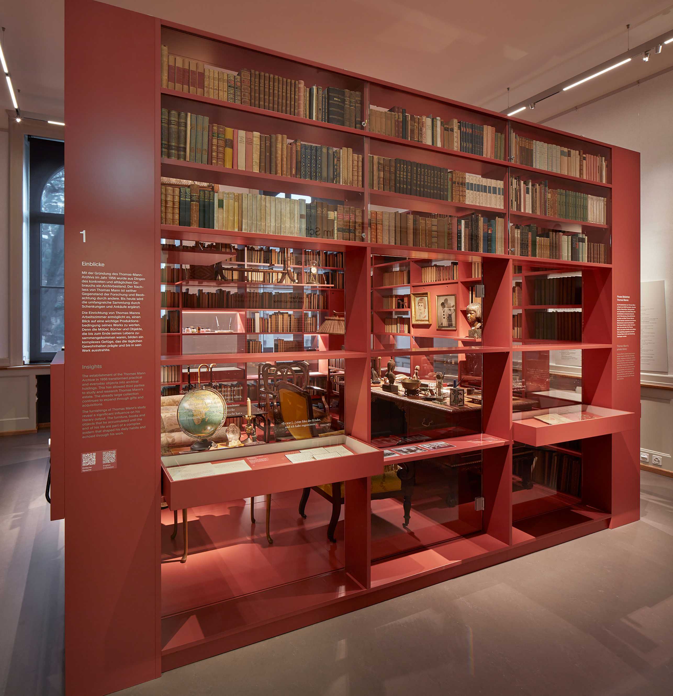 Red shelf with books from the exhibition in the ETH main building