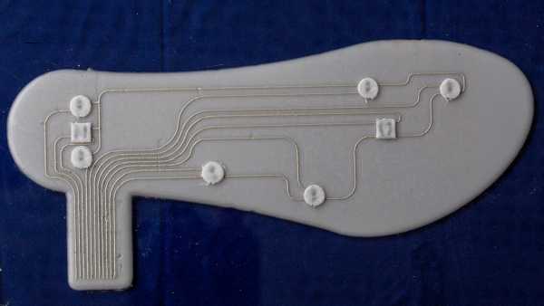 Finished insole produced from above, sensors distributed on the sole.