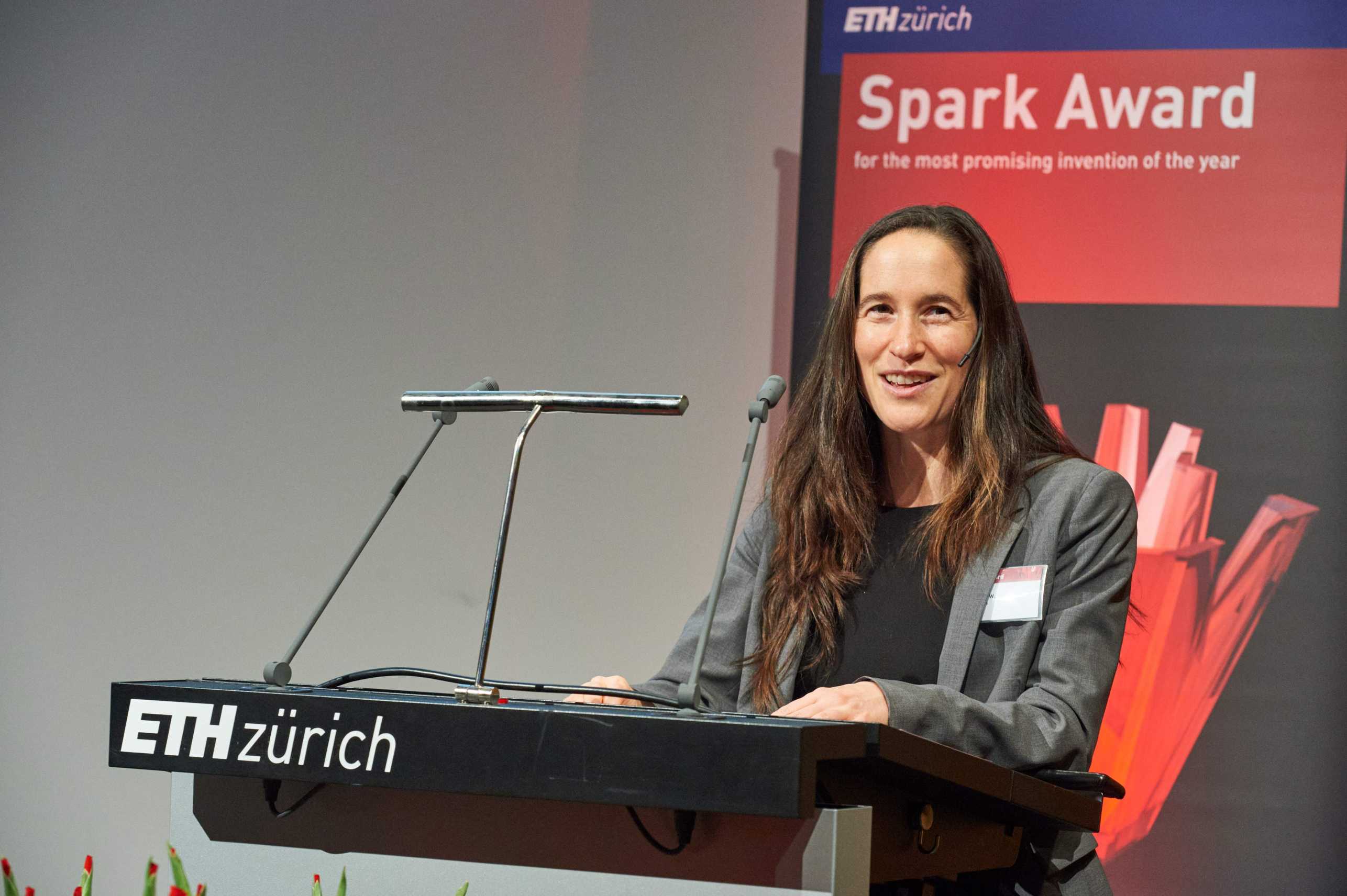Vanessa Wood at the lectern at ETH Zurich during the Spark Award ceremony.