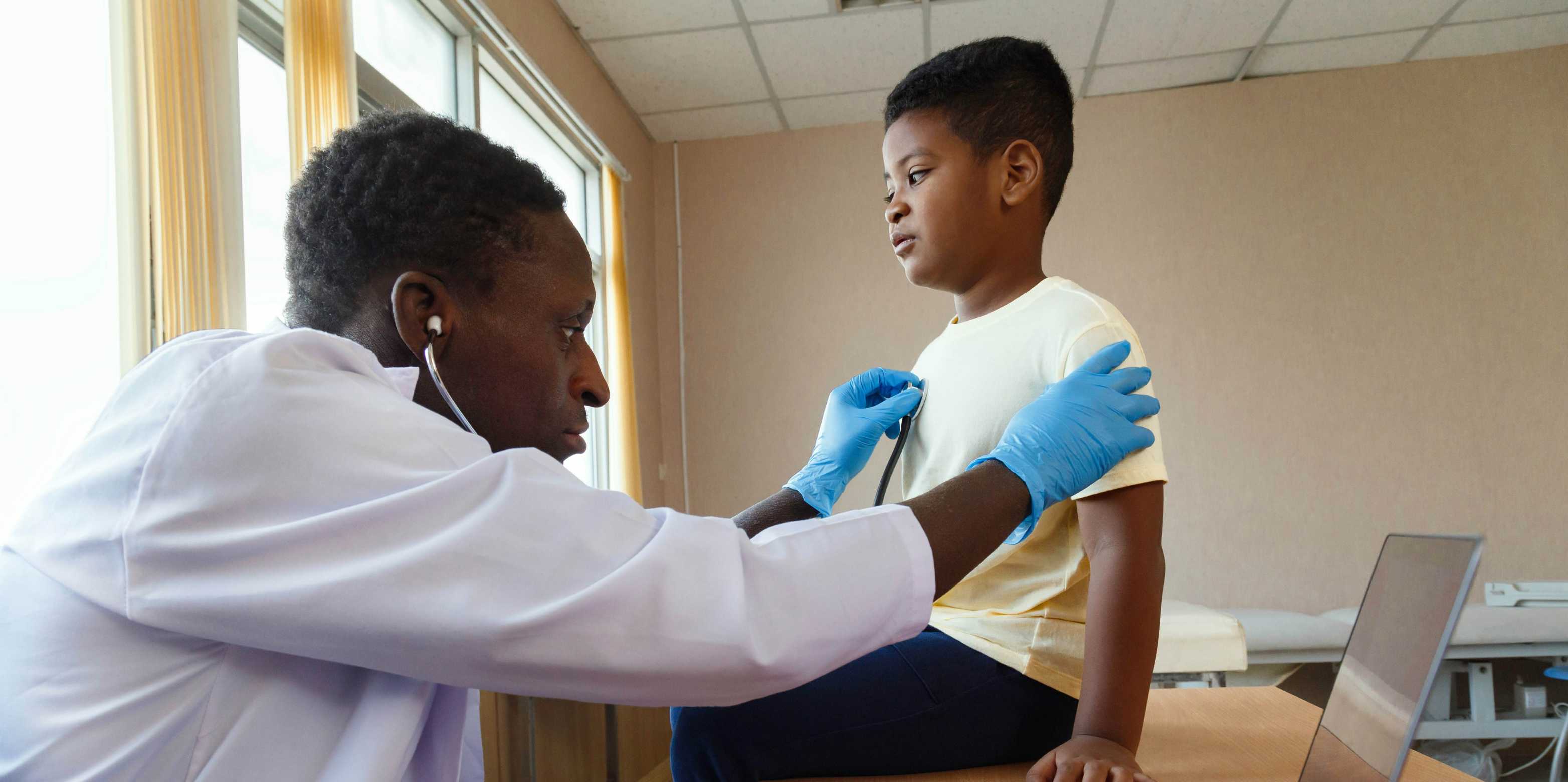 A doctor examines a child