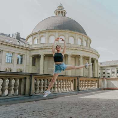 Woman dancing in front of the main building of ETH Zurich