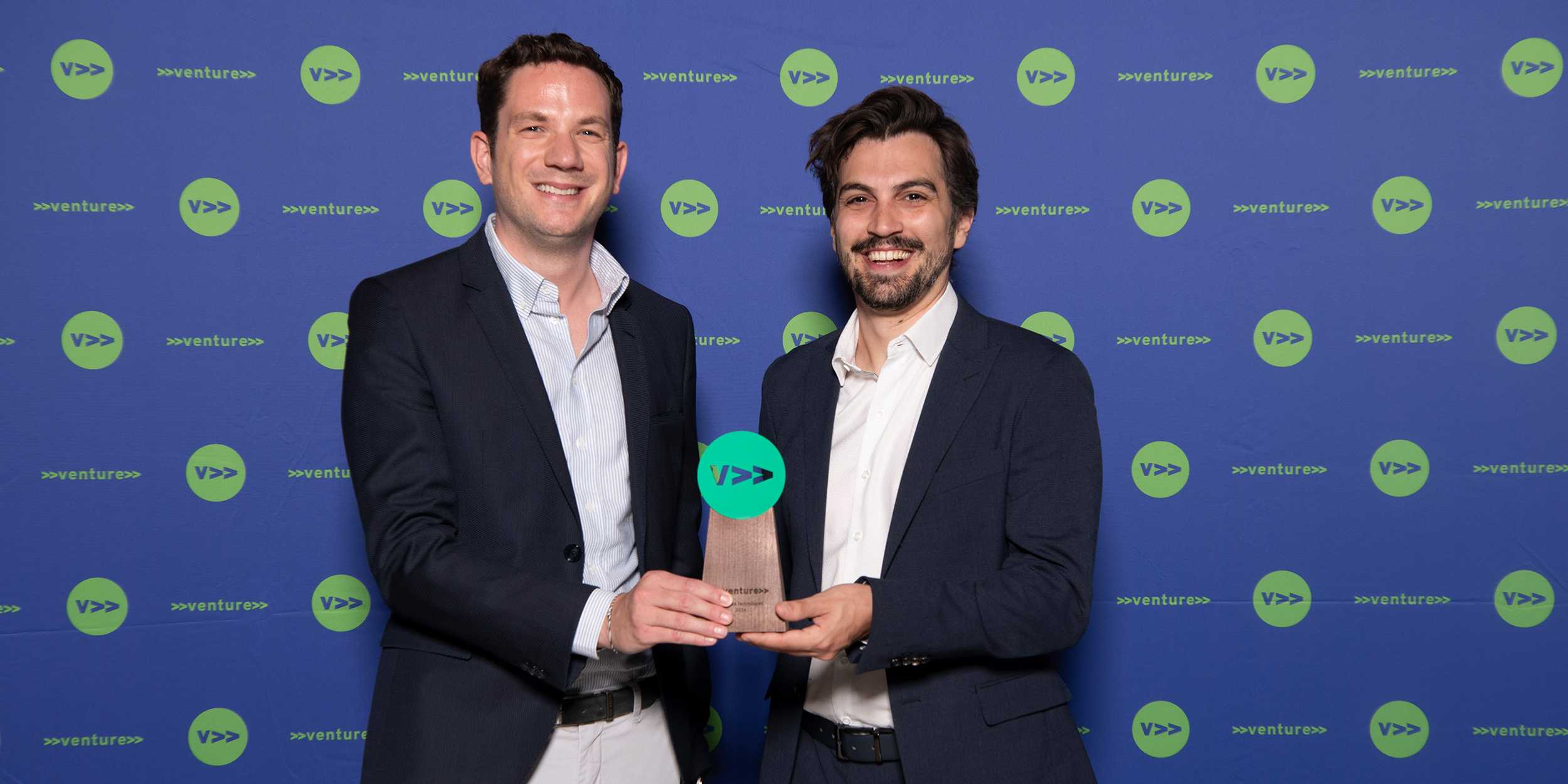 Winning photograph of the entrepreneurs behind Climada, the winners holding the prize in their hands