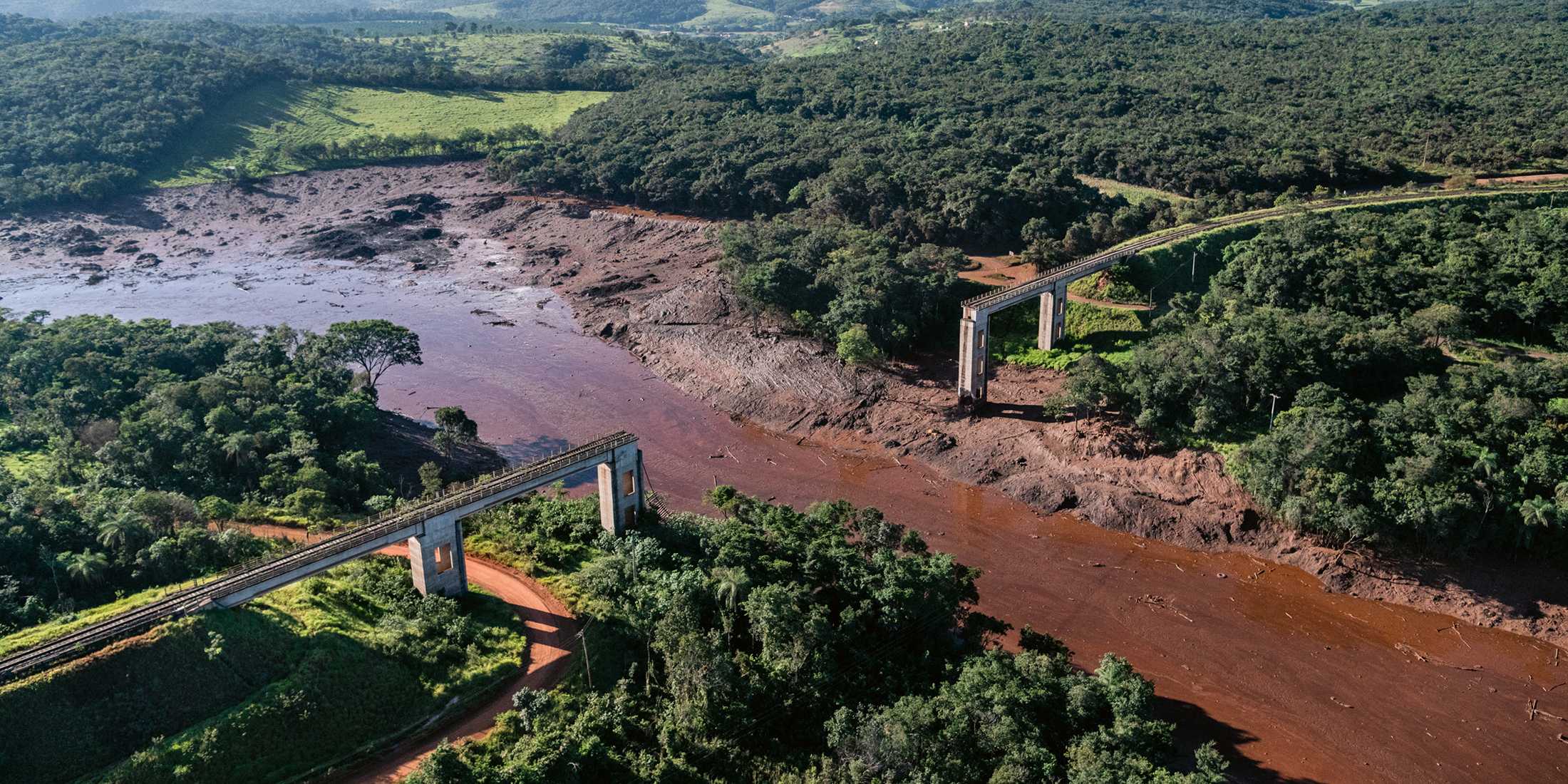 Muddy river and destroyed bridge