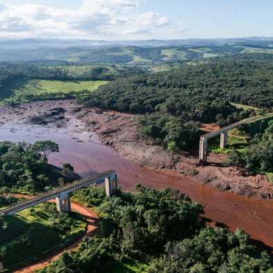 Muddy river and destroyed bridge