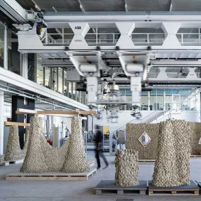 Production hall with various clay sculptures built by robots