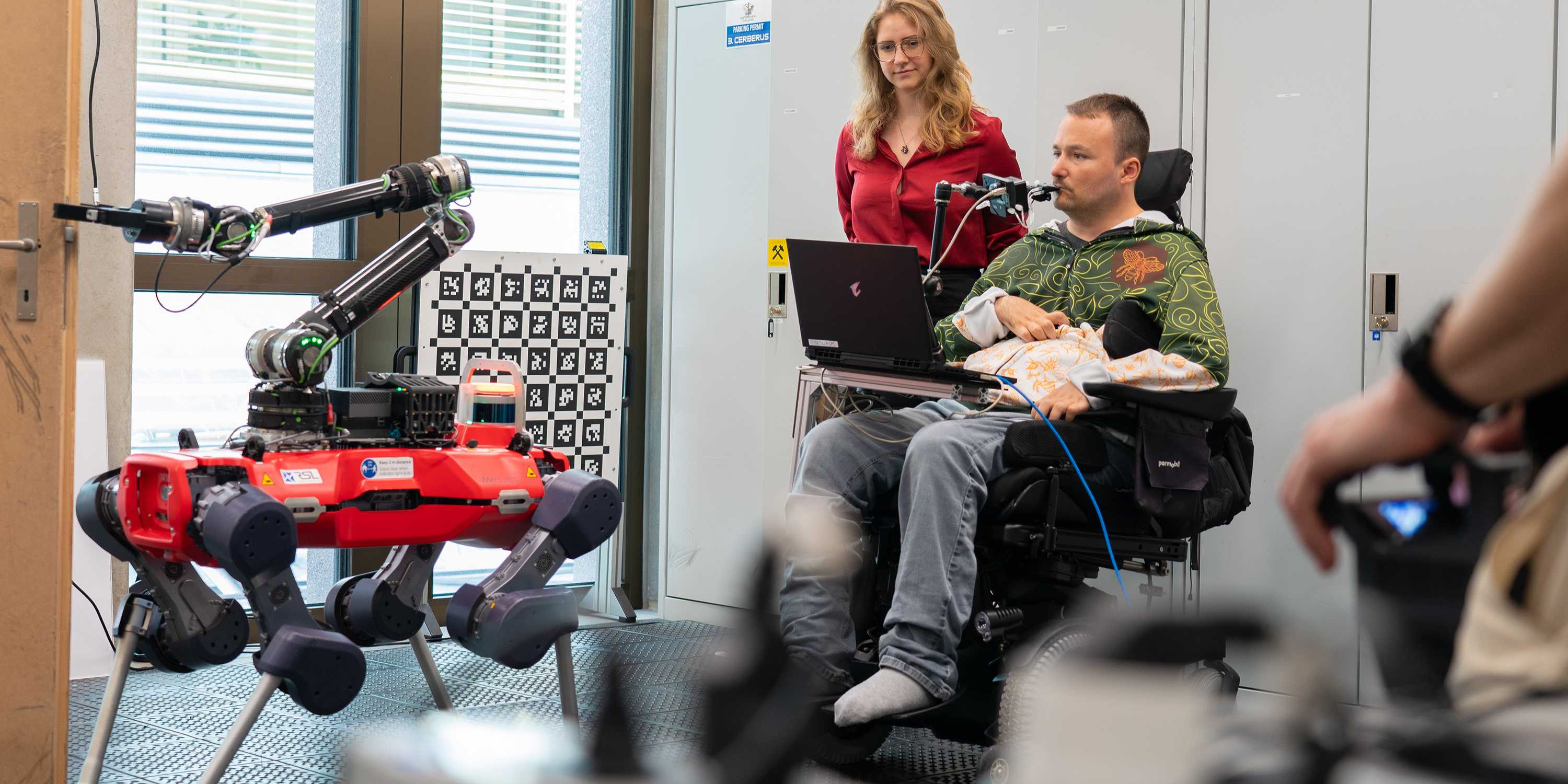 Paraplegic pilot Sammy Kunz completes a parkour in training for the cybathlon with the help of the assistant robot