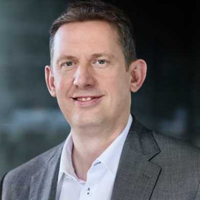 A portrait photo shows ETH Vice-President Christian Wolfrum against a dark background.