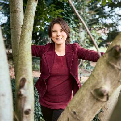 Portrait photo of Bettina Heim in the forest