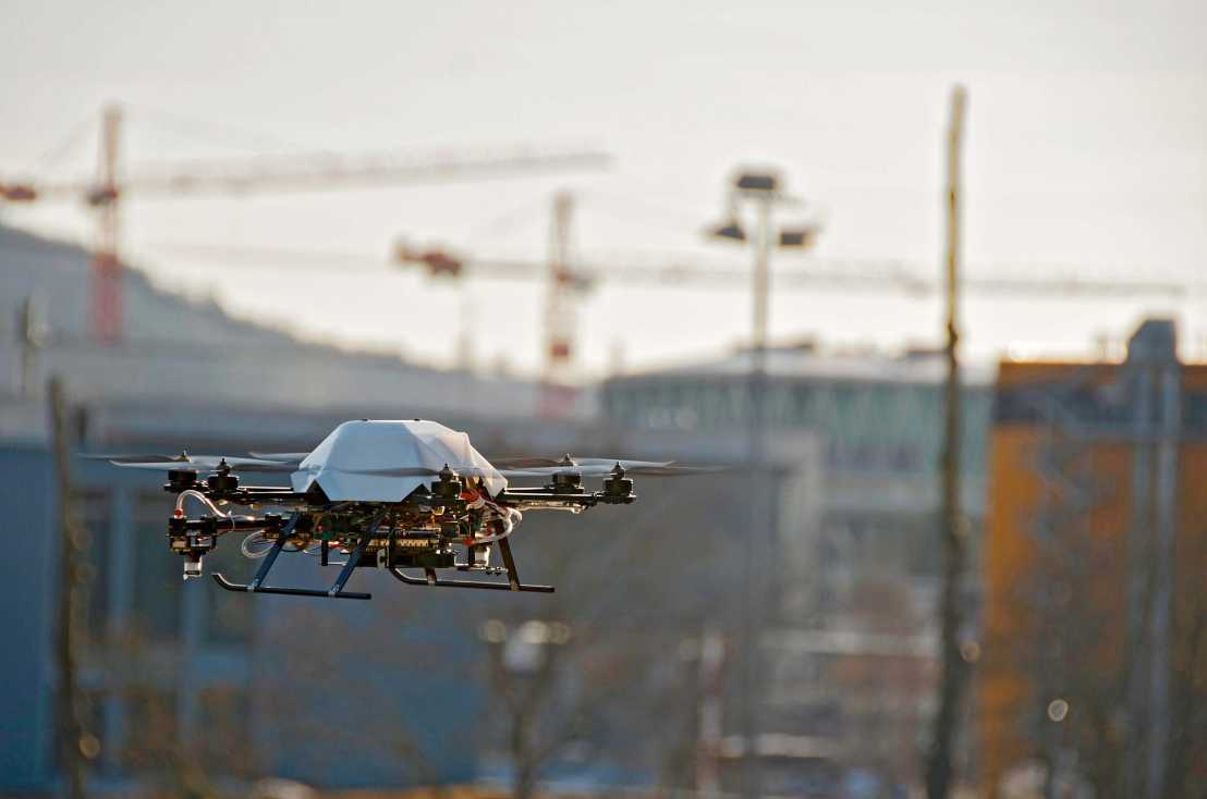 Enlarged view: Drone in the air, blurred skyscrapers and cranes in the background