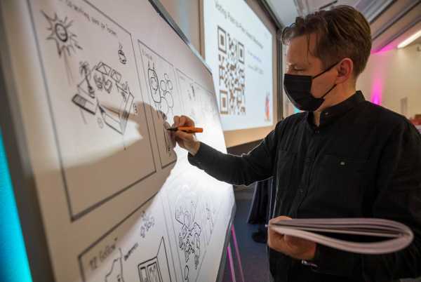 a man sketching the presentation