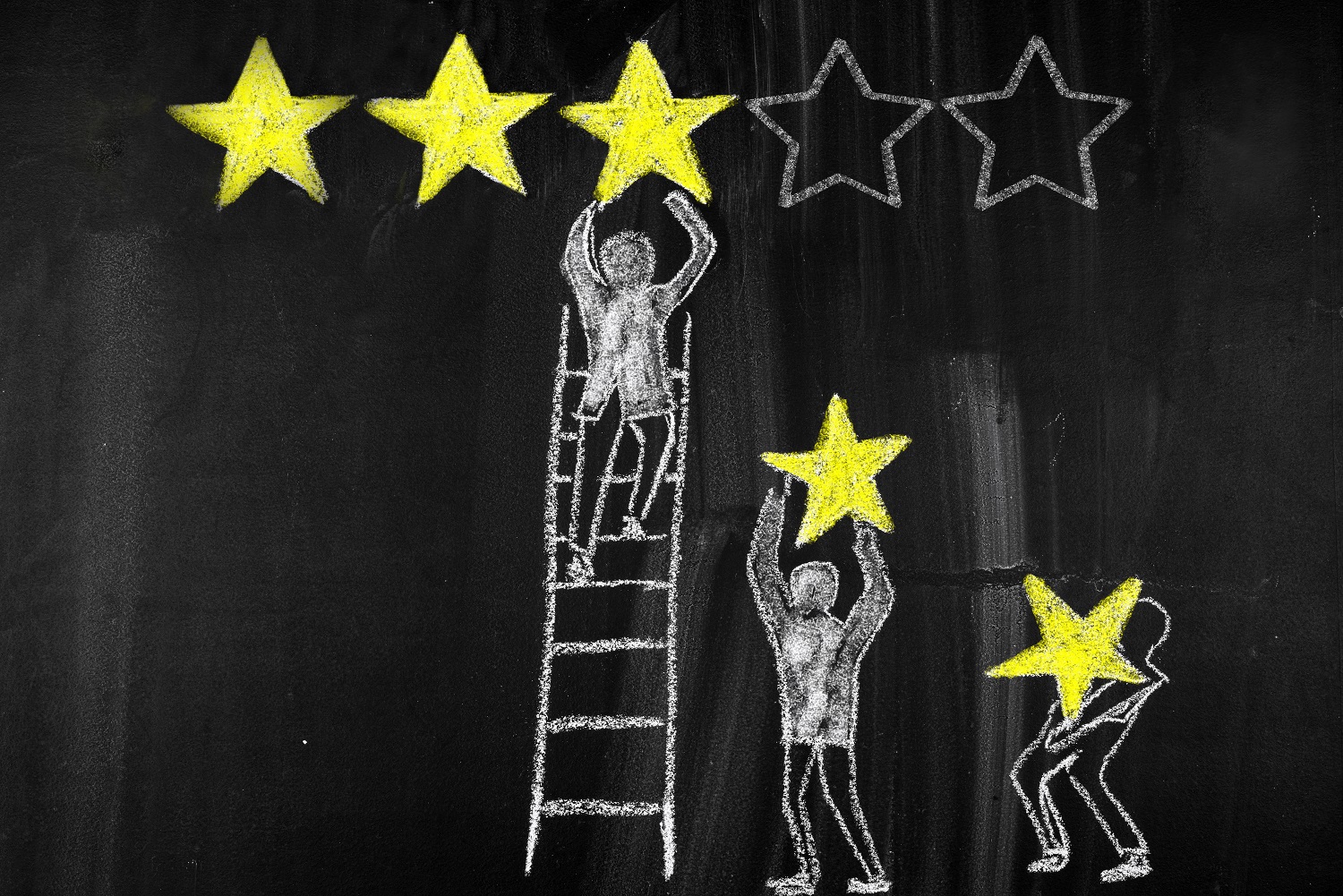 Whiteboard, three painted humansattaching stars to a board