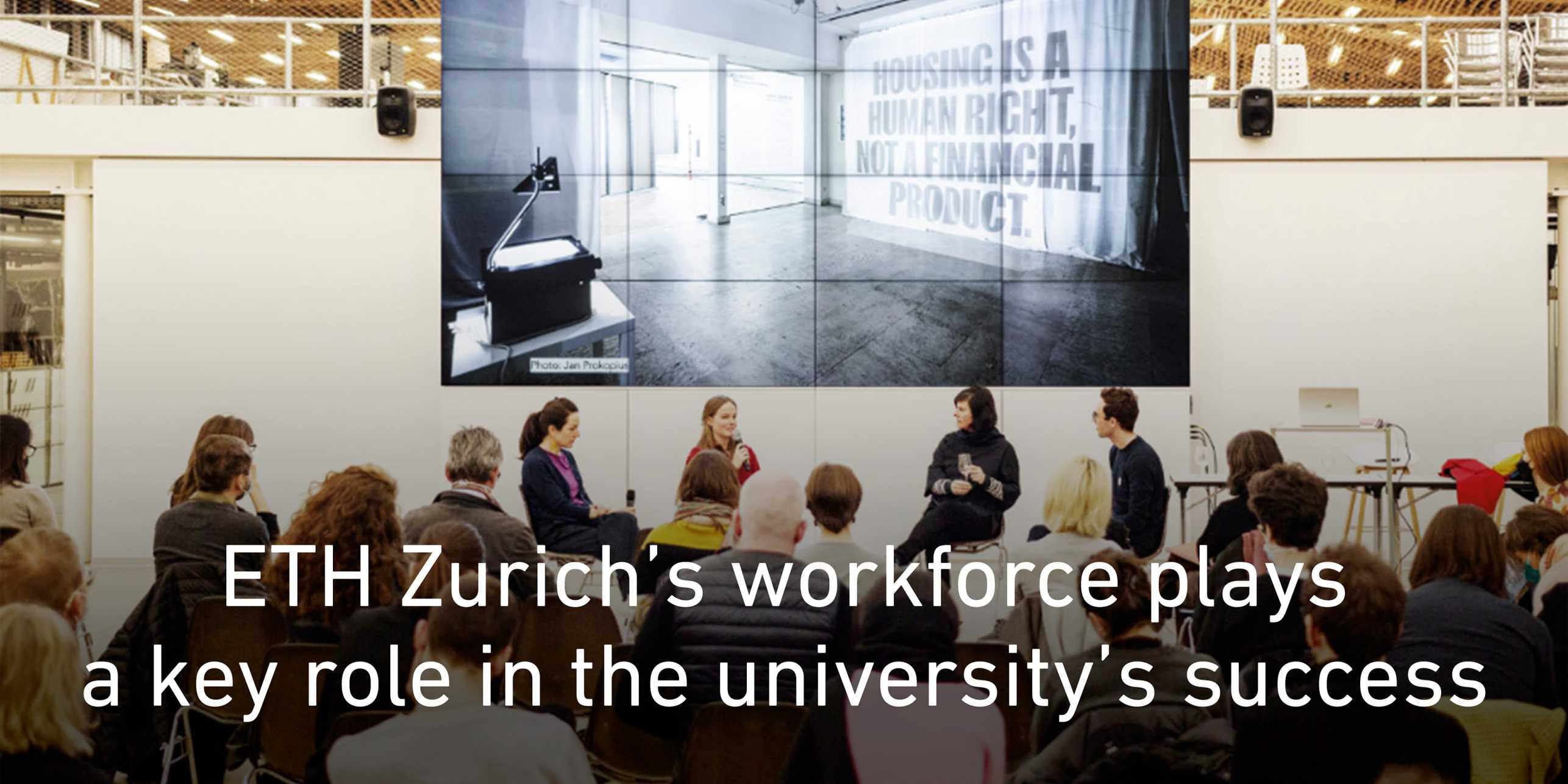 Discussion panel with several participants. Text: ETH Zurich’s workforce plays a key role in the university’s success. Link to news article: Parity Group wins Prix Meret Oppenheim.