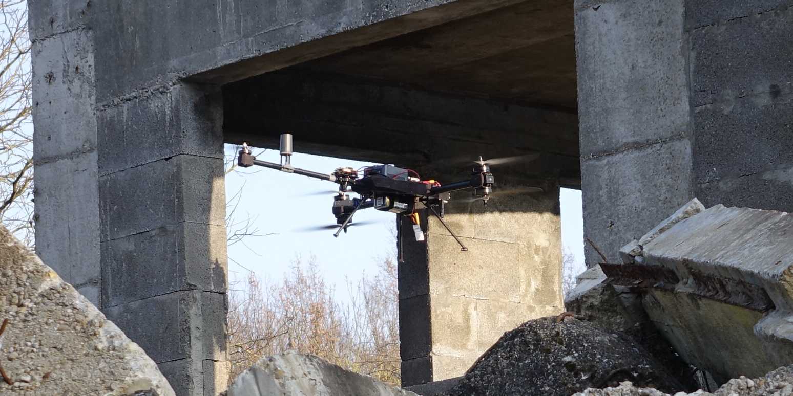 Omnidirectional drone navigates into a collapsed building for inspection.