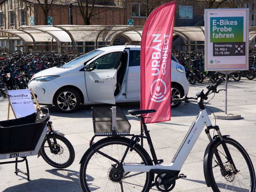 Enlarged view: Bikes with poster and flag on the ETH grounds for the bikesharing showcase