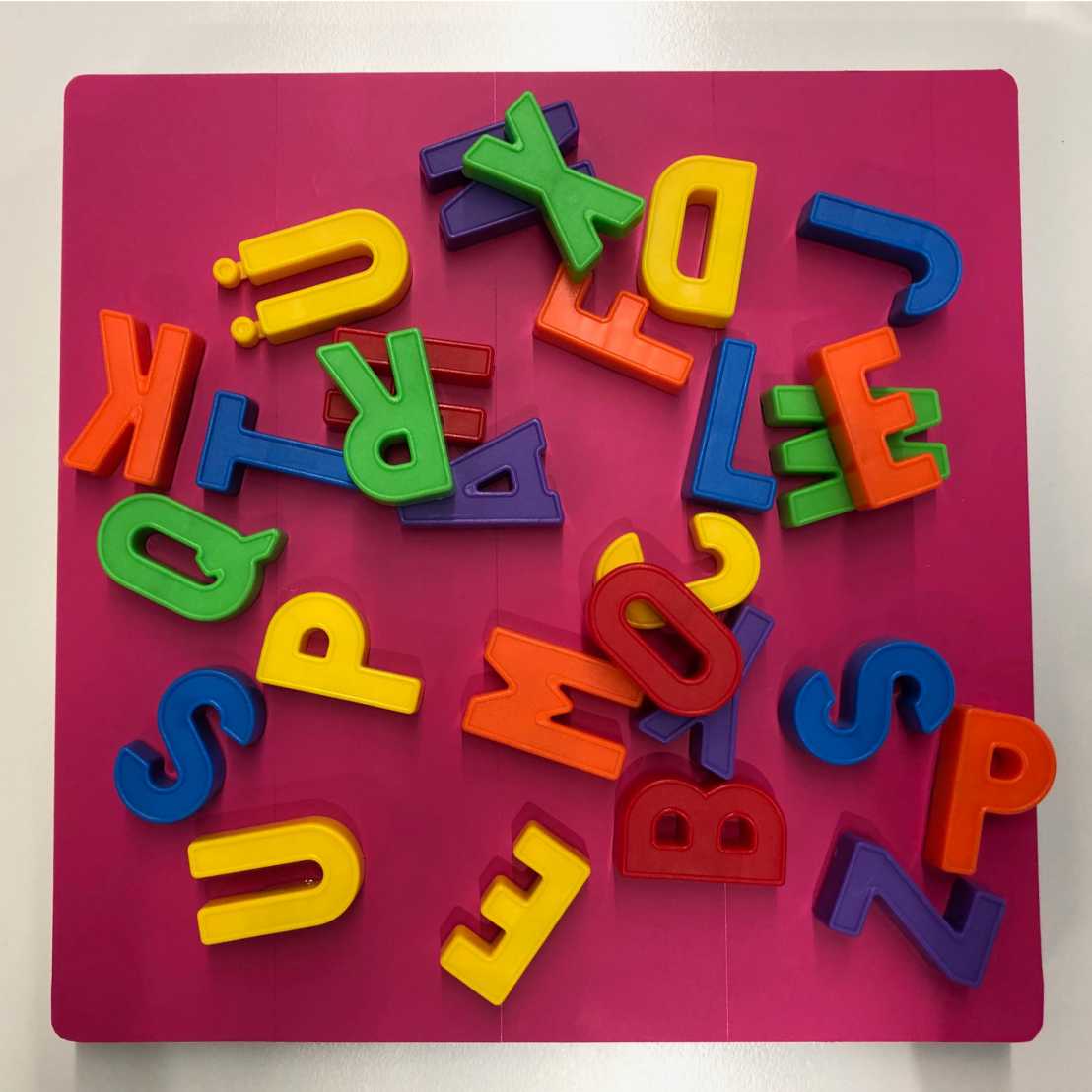 colourful and jumbled letters made of plastic