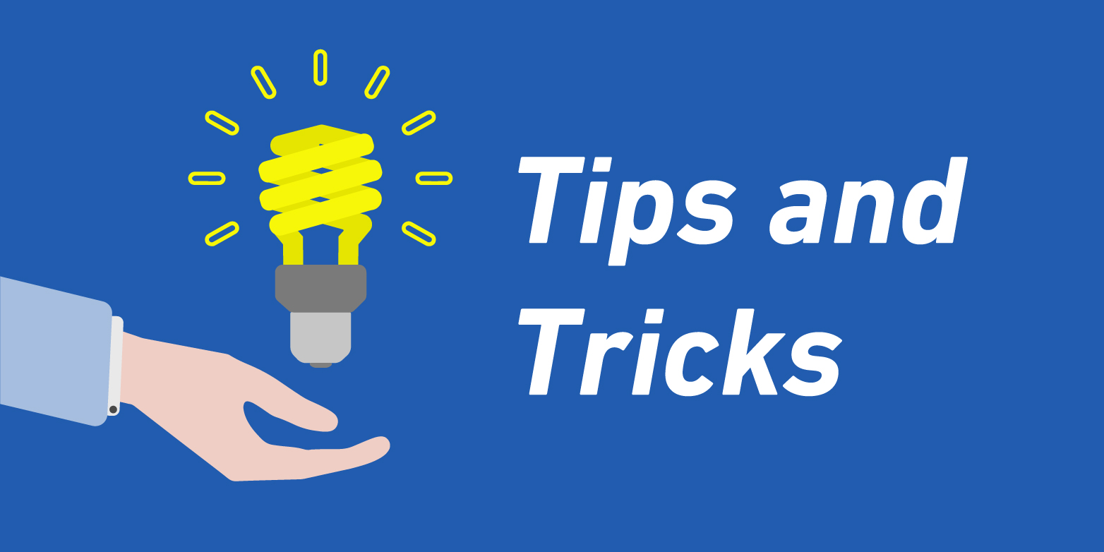 Light bulb hovering over a hand, next to it the lettering "Tips and Tricks".