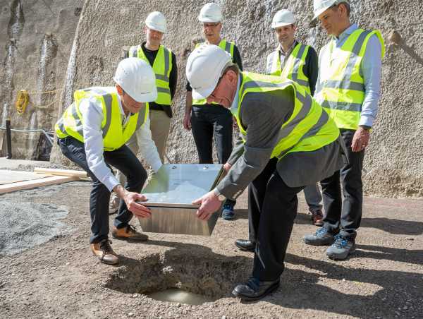 The time capsule is placed in the ground.