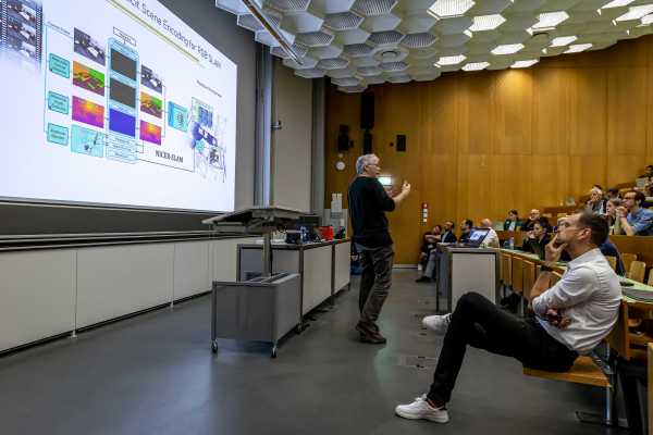 Professor explains something in the lecture hall